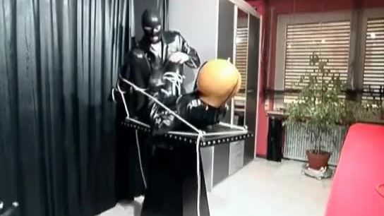 Kinky sex scene with a man in latex